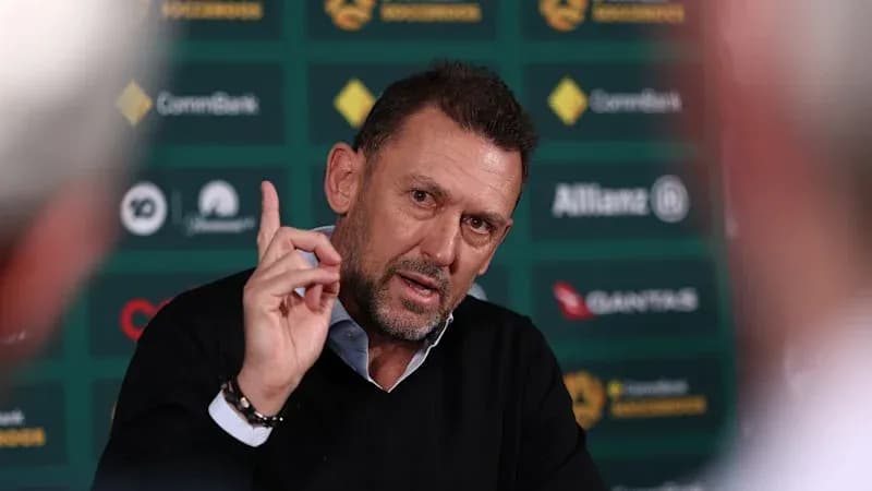 Coach speaking at press conference with gesturing hand Coach speaking at press conference with gesturing hand
