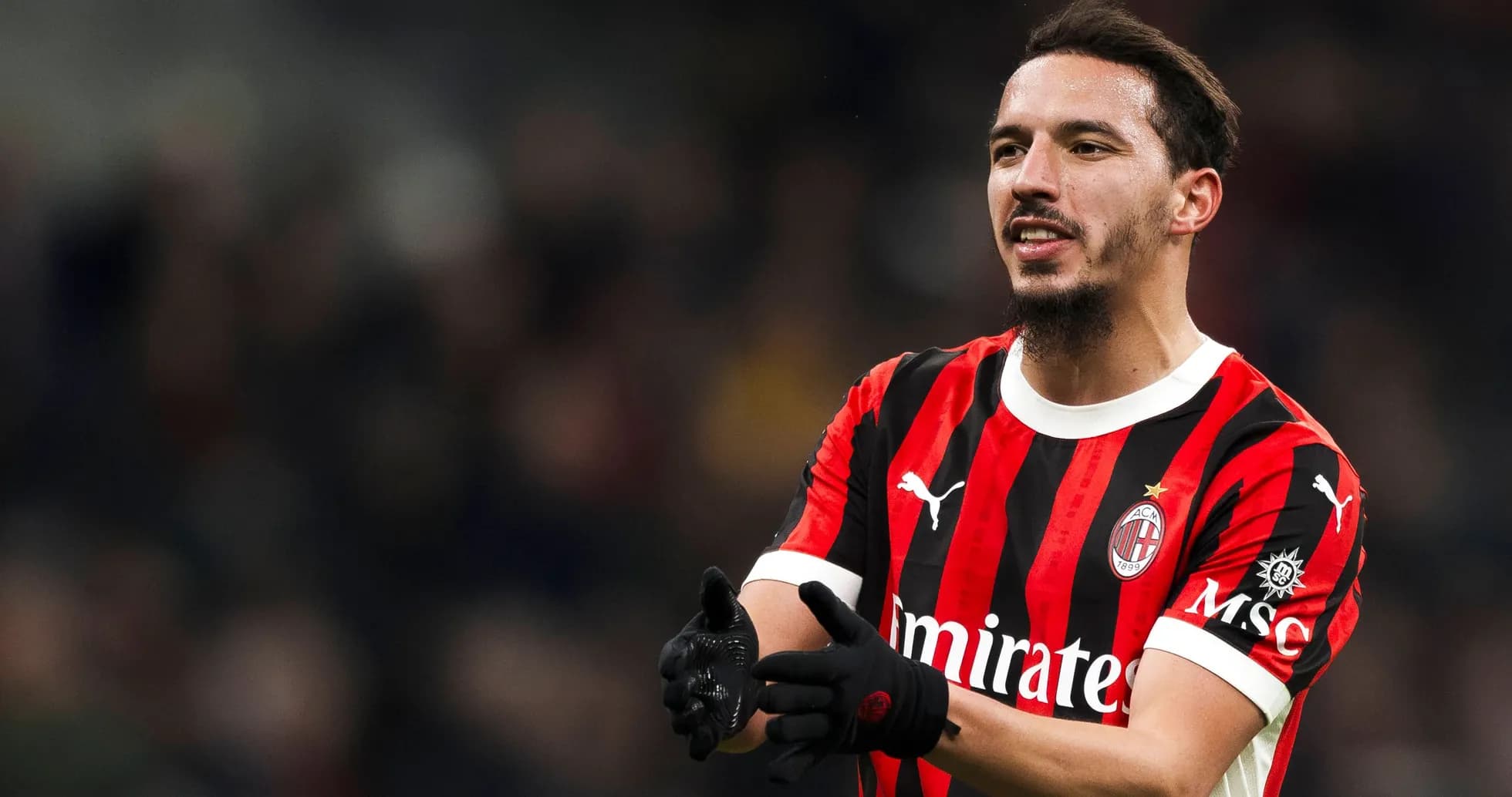 AC Milan player gesturing during a match AC Milan player gesturing during a match