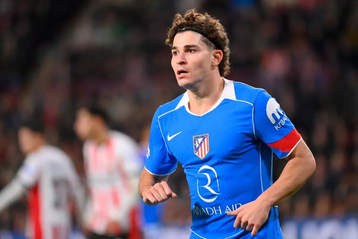 Player in blue Atlético Madrid kit during match Player in blue Atlético Madrid kit during match