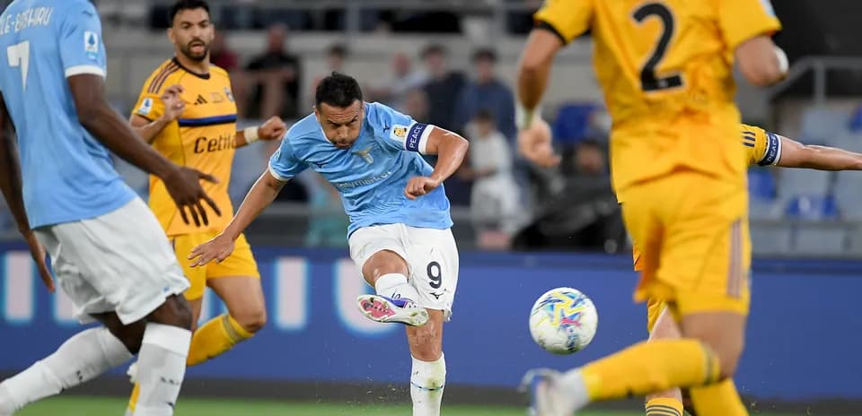 Lazio player taking a shot on goal Lazio player taking a shot on goal