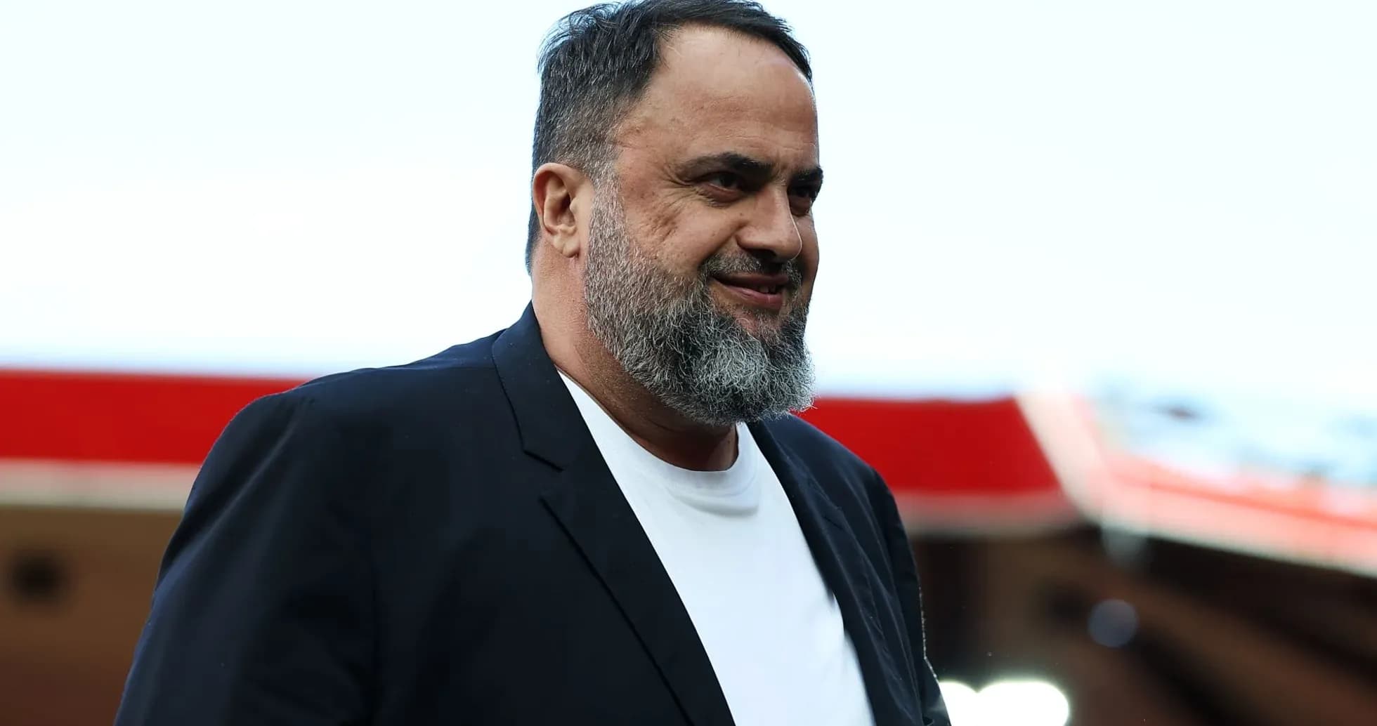 Man with beard walking at stadium entrance Man with beard walking at stadium entrance