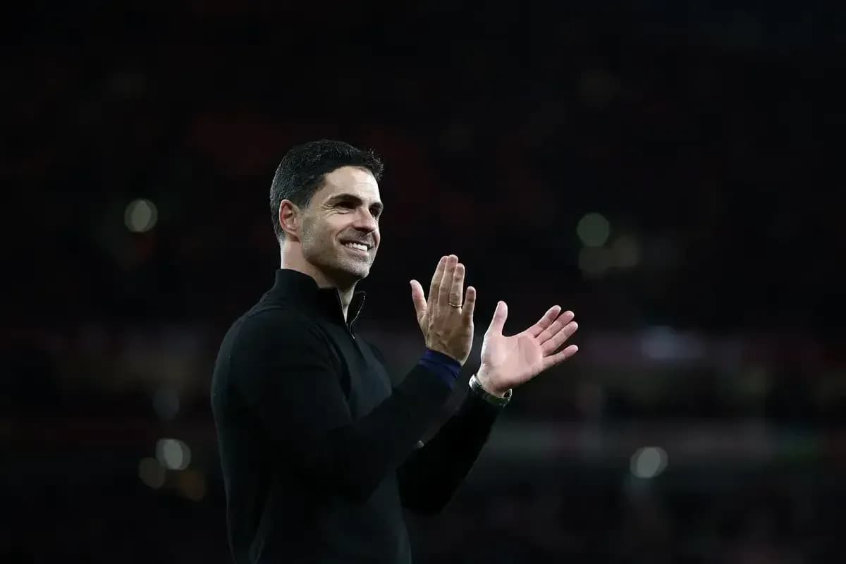 Manager applauding the crowd after the match Manager applauding the crowd after the match