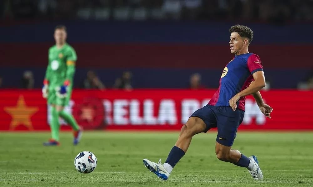 Player passing the ball during a football match Player passing the ball during a football match