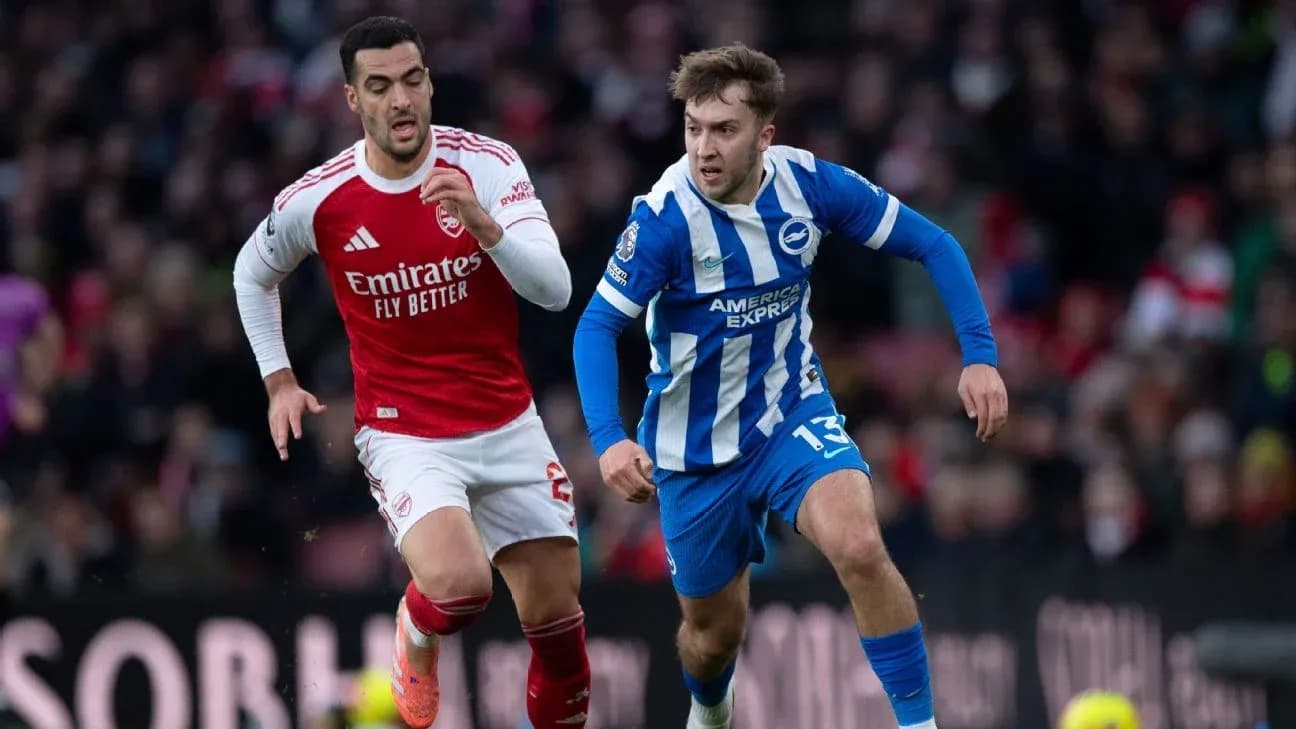 Arsenal and Brighton players competing for the ball Arsenal and Brighton players competing for the ball