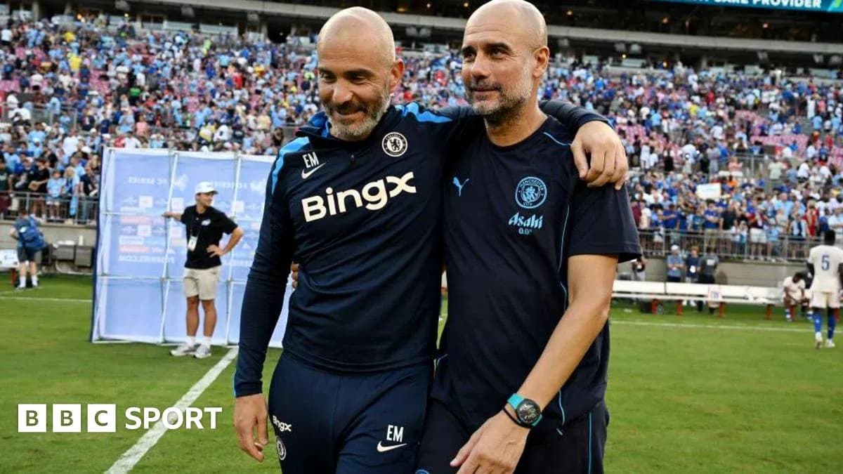 Two football coaches celebrating on the pitch Two football coaches celebrating on the pitch