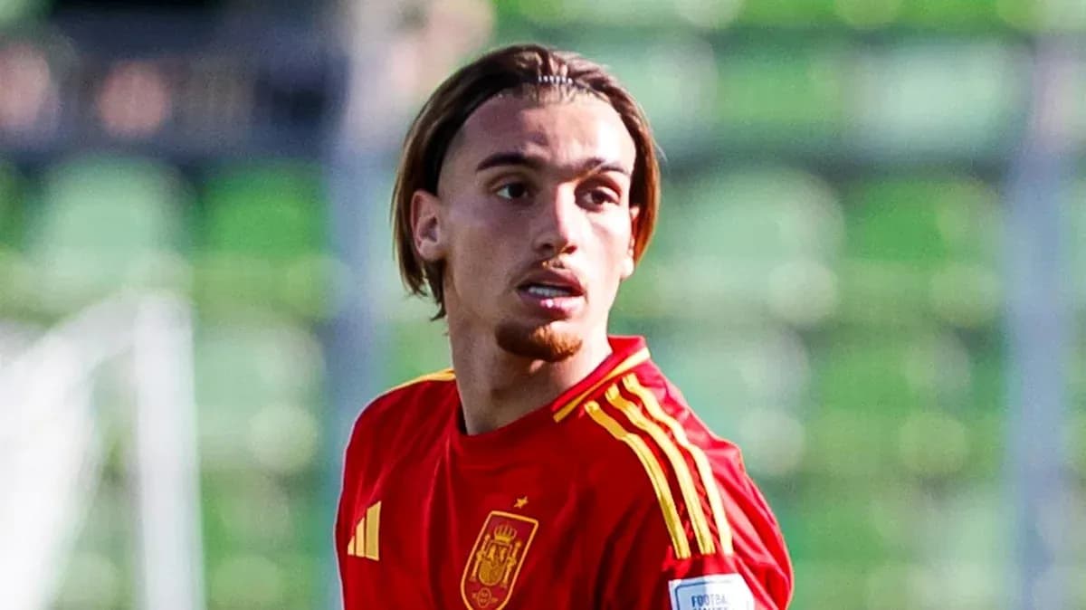 Player wearing Spain national team jersey on field Player wearing Spain national team jersey on field
