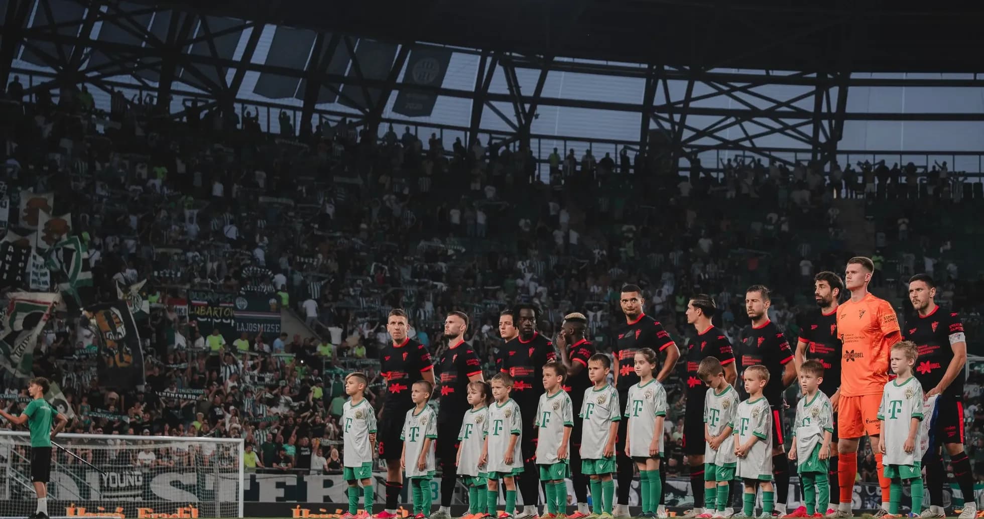 Players and children standing before the match Players and children standing before the match