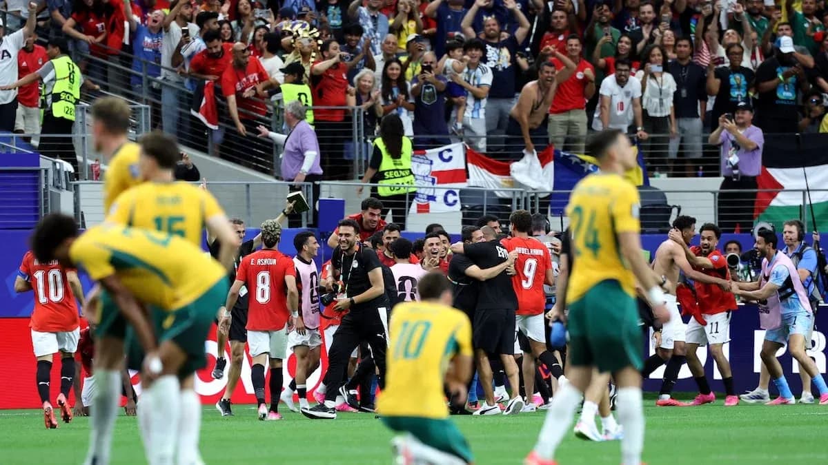 Players celebrating victory with fans in stadium Players celebrating victory with fans in stadium