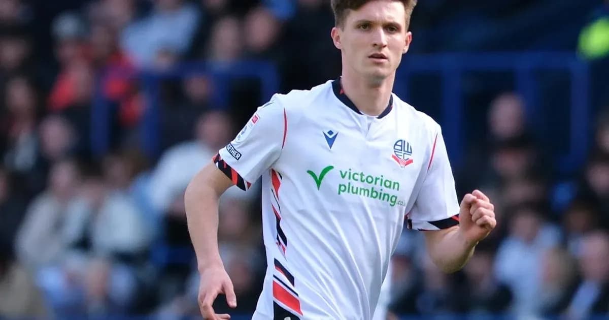 Bolton Wanderers player running during a match Bolton Wanderers player running during a match