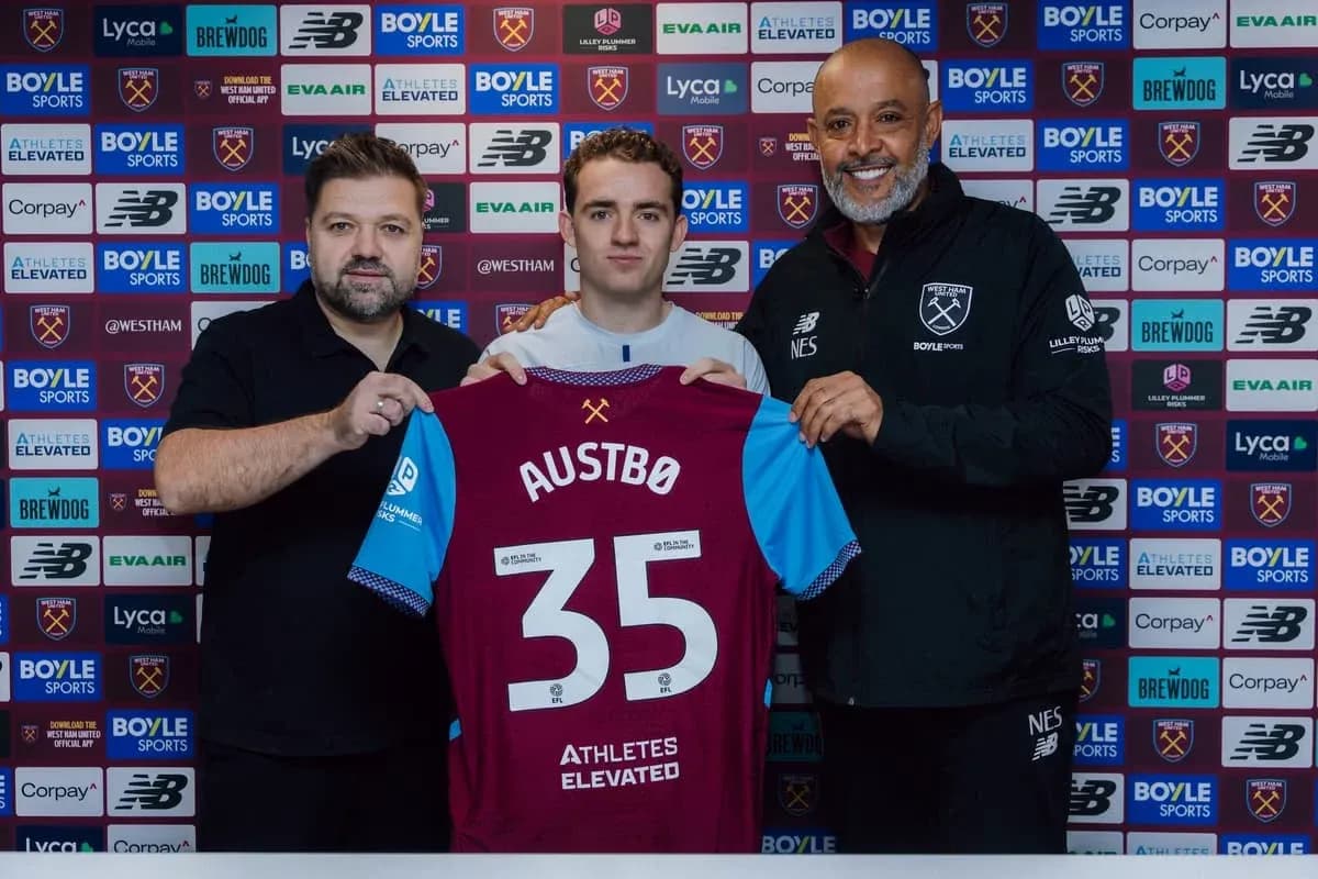 New player holding jersey at signing announcement New player holding jersey at signing announcement