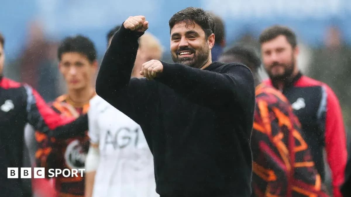 Coach celebrating with team during training session Coach celebrating with team during training session
