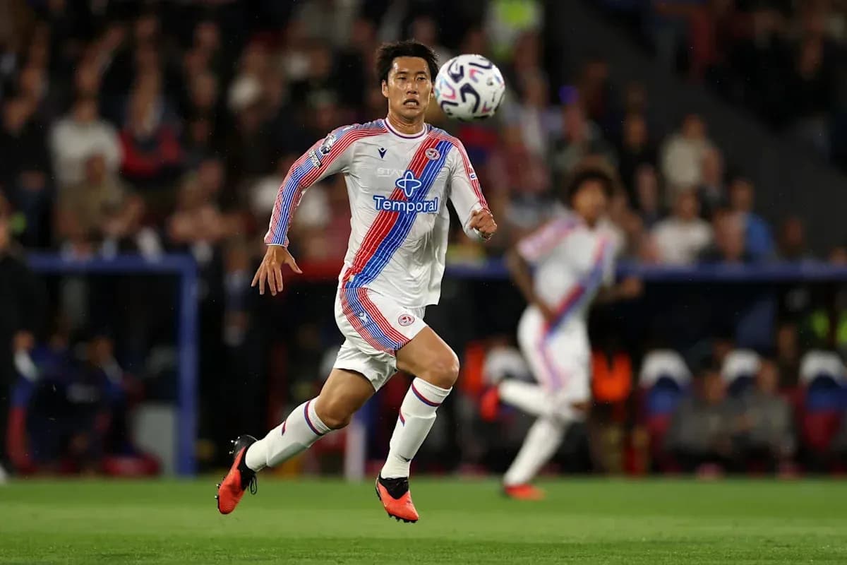 Player running with ball during a match Player running with ball during a match