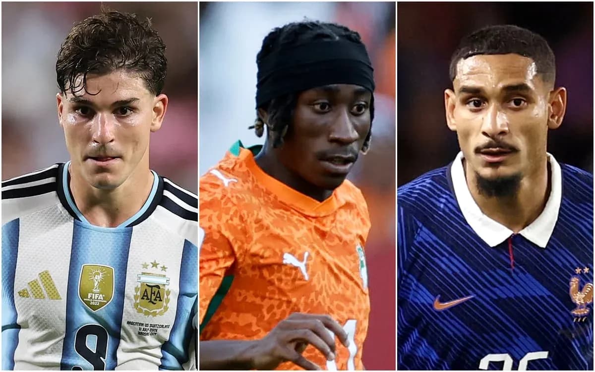 Three soccer players from different teams in action Three soccer players from different teams in action