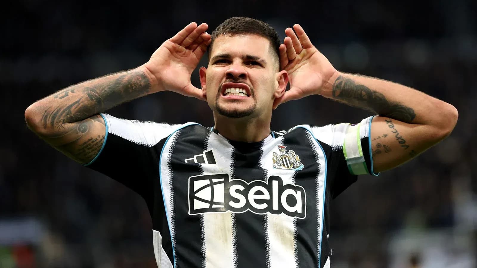 Player celebrating with hands to ears after scoring Player celebrating with hands to ears after scoring
