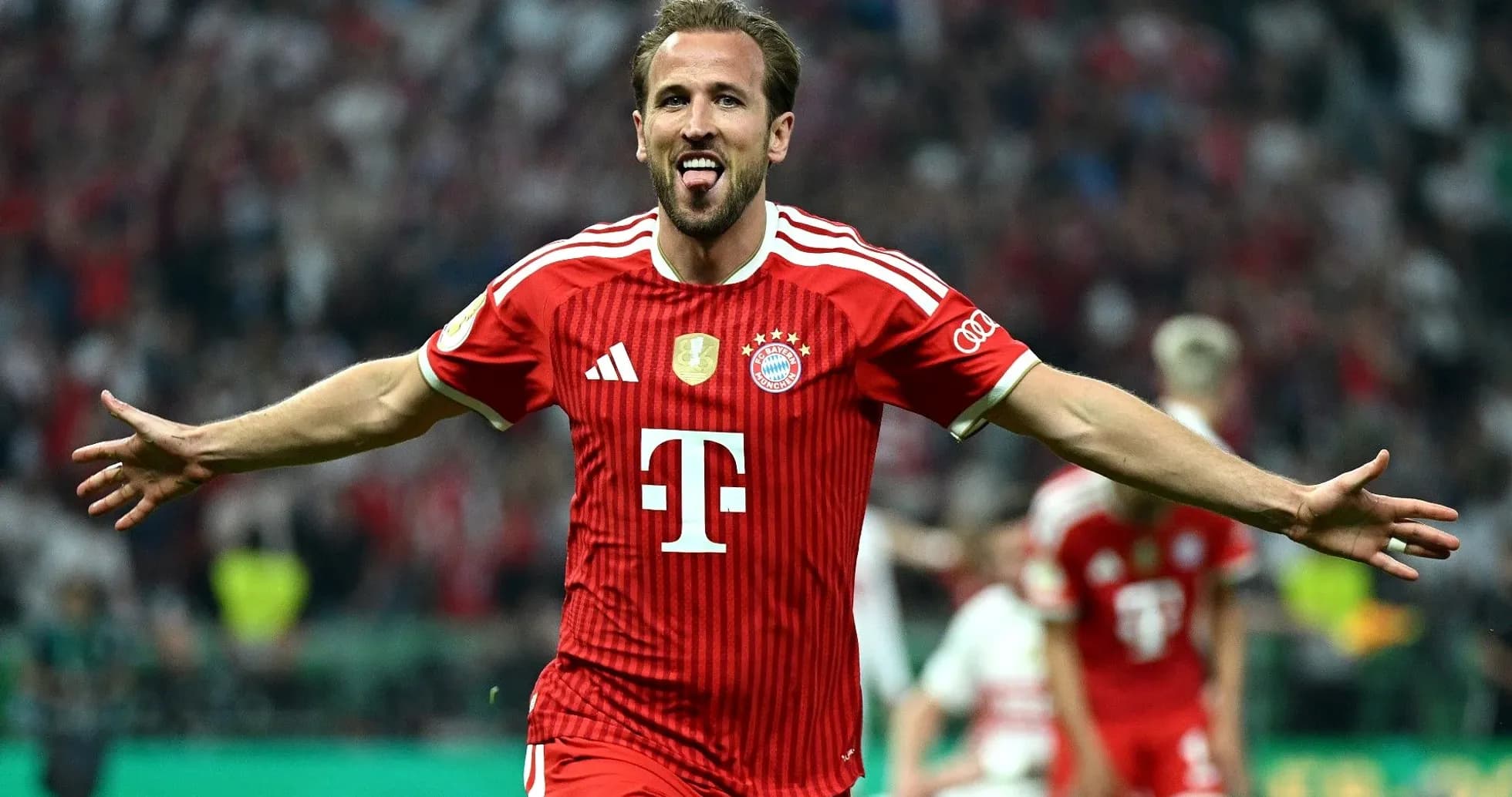 Bayern Munich player celebrating a goal on field Bayern Munich player celebrating a goal on field