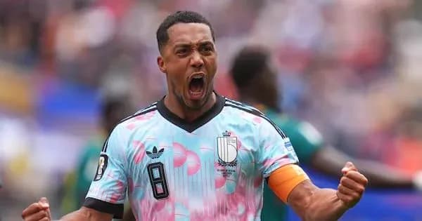 Player celebrating a goal in colorful jersey Player celebrating a goal in colorful jersey