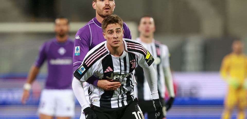 Juventus player being challenged during match Juventus player being challenged during match