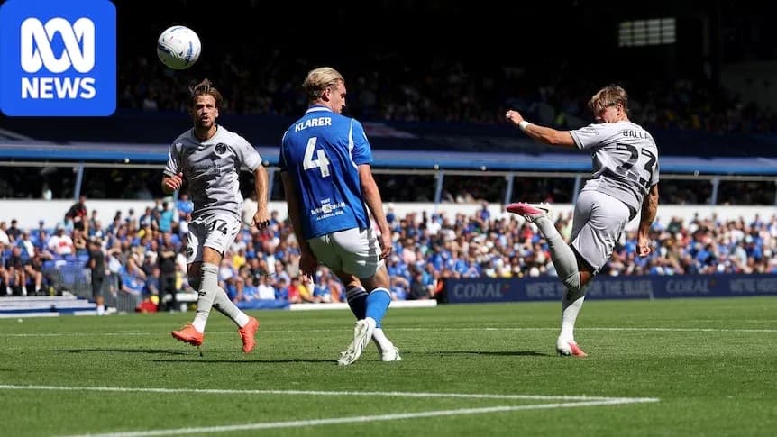 Player kicking ball during football match action Player kicking ball during football match action