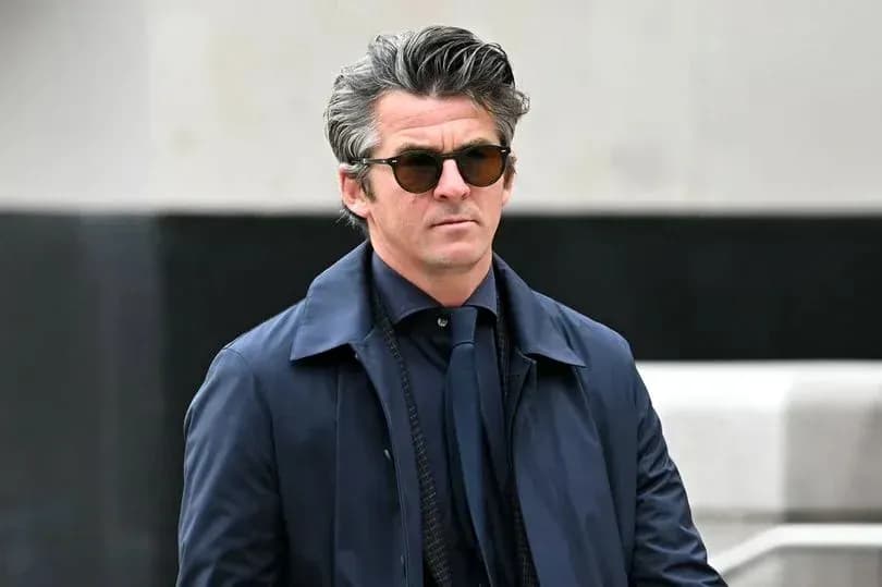 Man in sunglasses walking outdoors in stylish attire Man in sunglasses walking outdoors in stylish attire