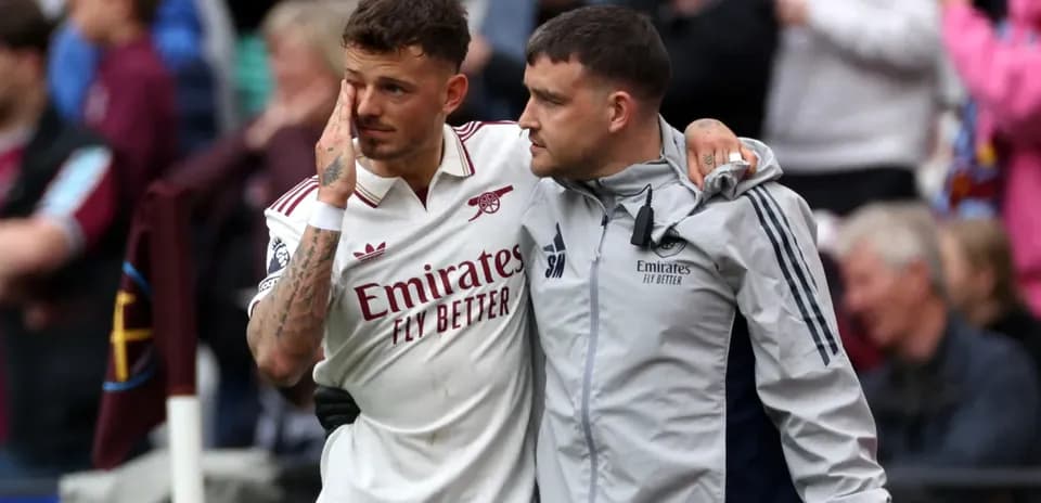 Player receiving support from staff after match Player receiving support from staff after match