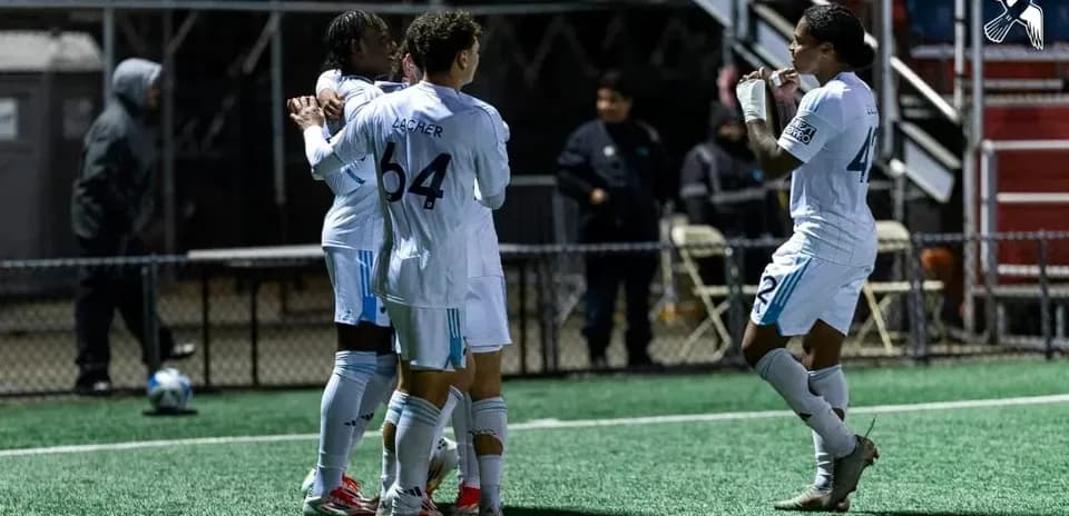 Players celebrating a goal during match Players celebrating a goal during match