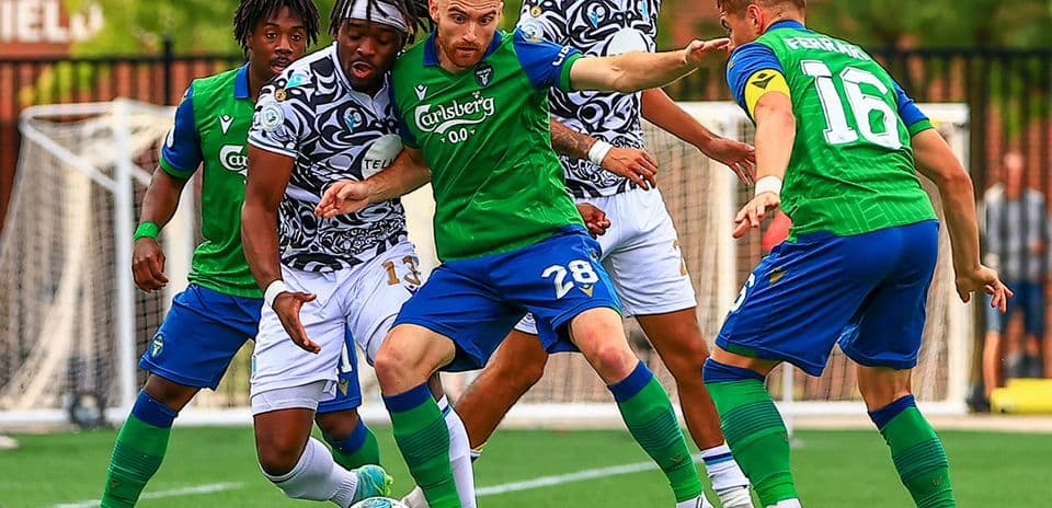 Pacific FC player battling for the ball Pacific FC player battling for the ball
