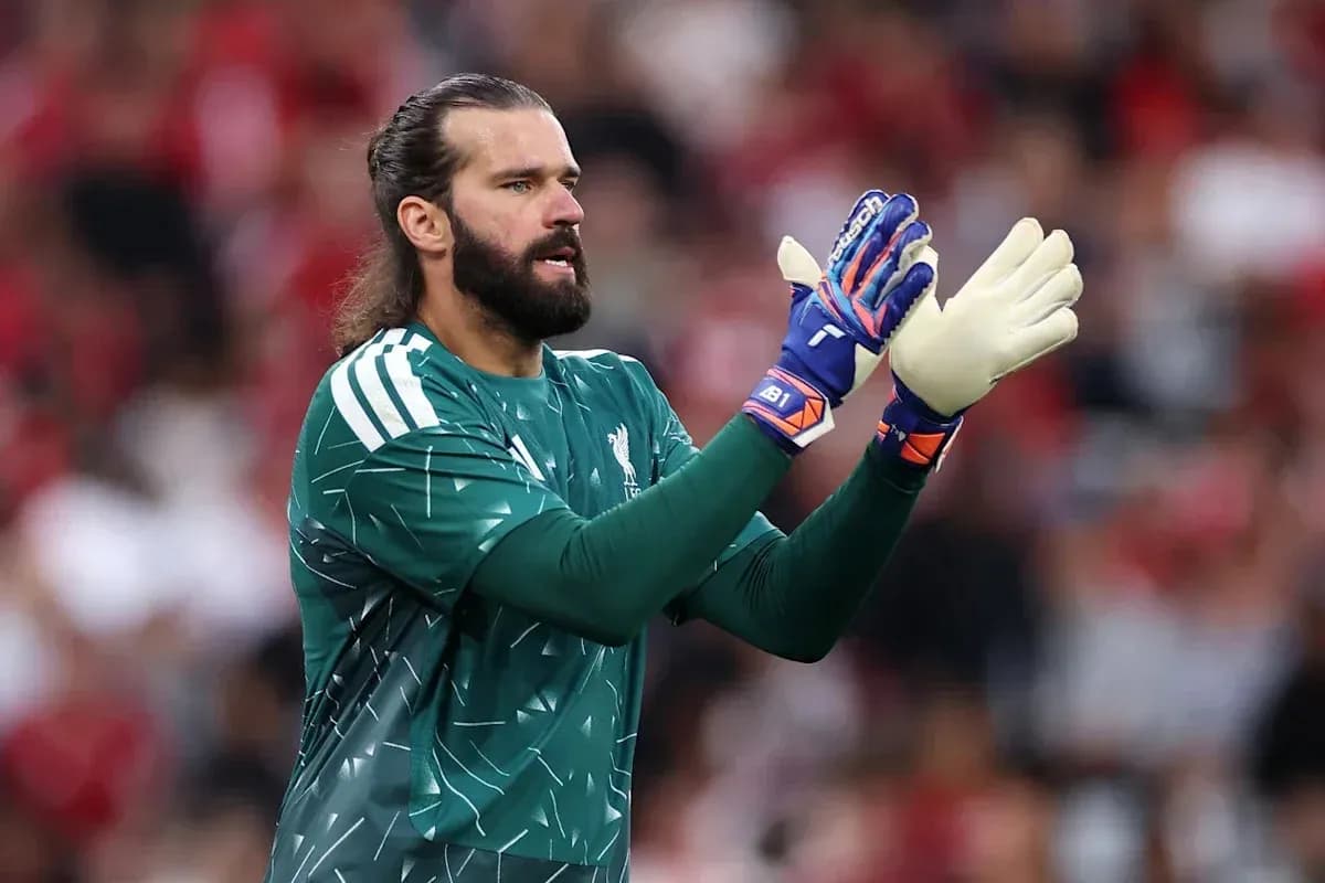 Goalkeeper wearing gloves during match preparation Goalkeeper wearing gloves during match preparation