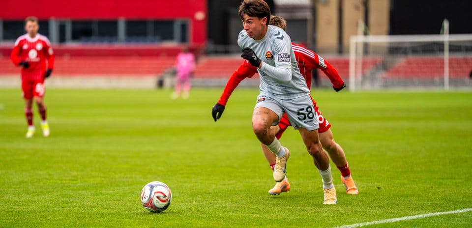 Player dribbling the ball during match Player dribbling the ball during match
