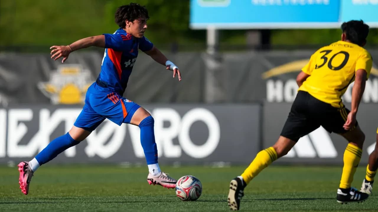 FC Cincinnati II player dribbling past Columbus Crew II FC Cincinnati II player dribbling past Columbus Crew II