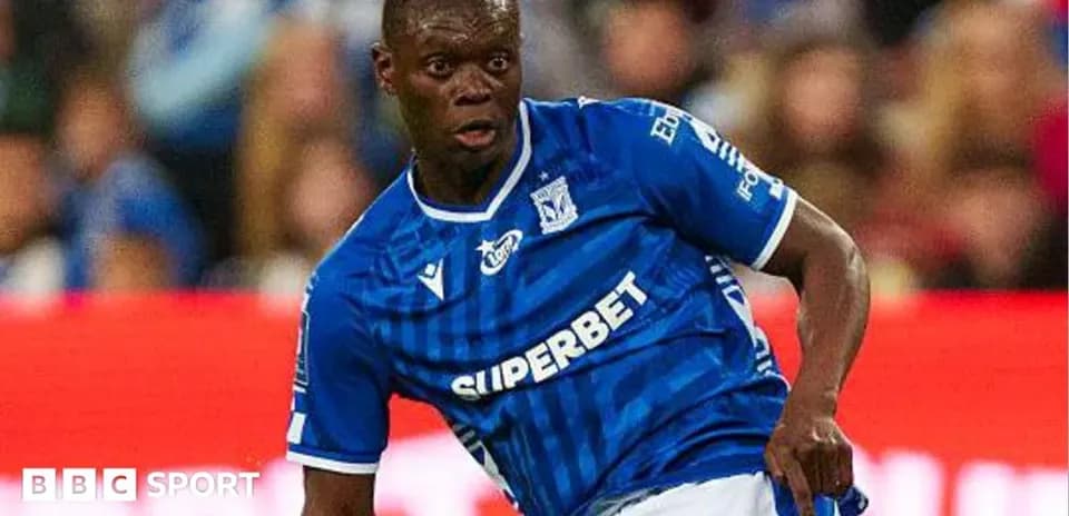 Player in blue jersey dribbling during match Player in blue jersey dribbling during match