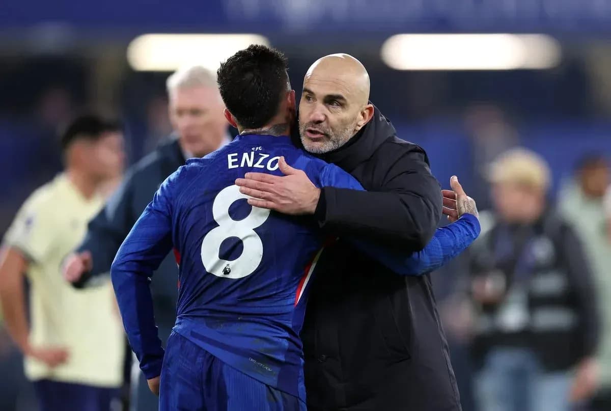 Player embracing coach after match on field Player embracing coach after match on field