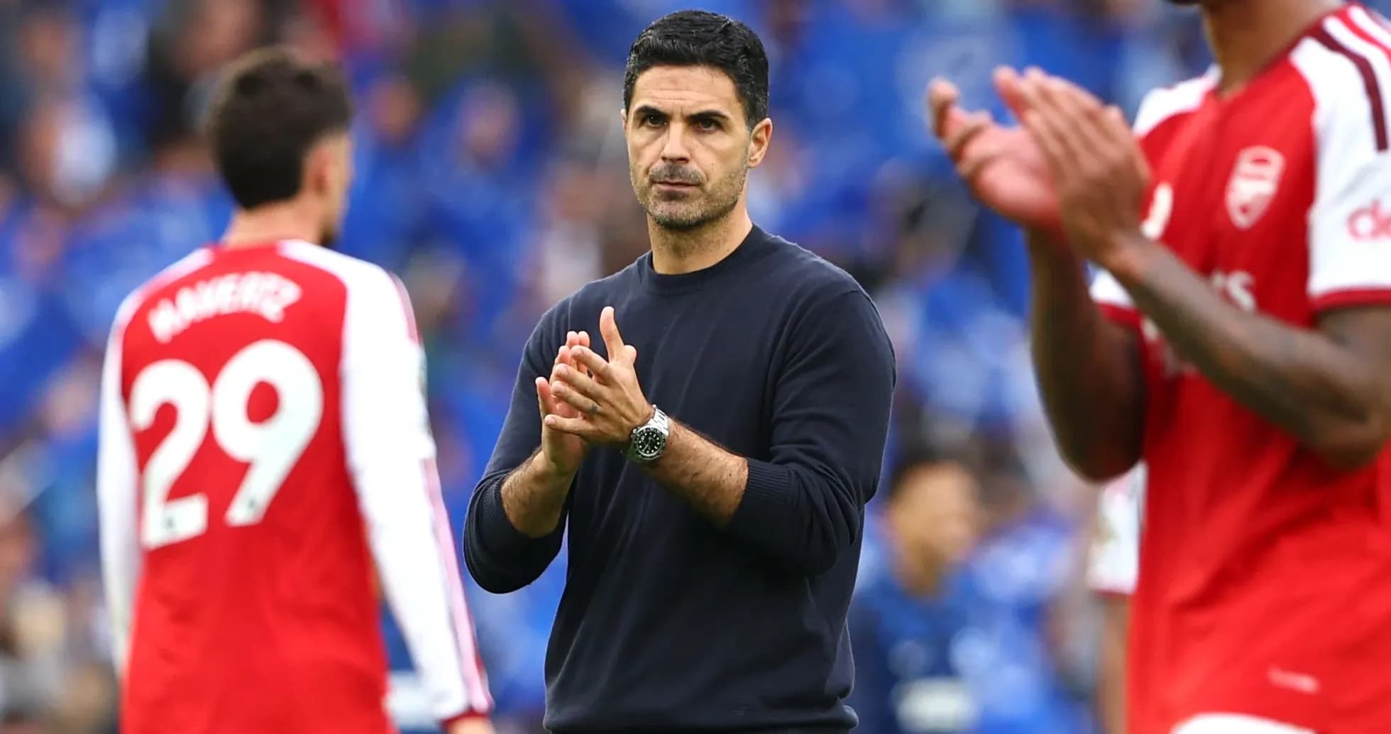 Manager applauding players during post-match interaction Manager applauding players during post-match interaction