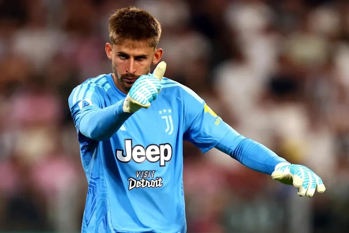 Goalkeeper in Juventus kit signaling during match Goalkeeper in Juventus kit signaling during match