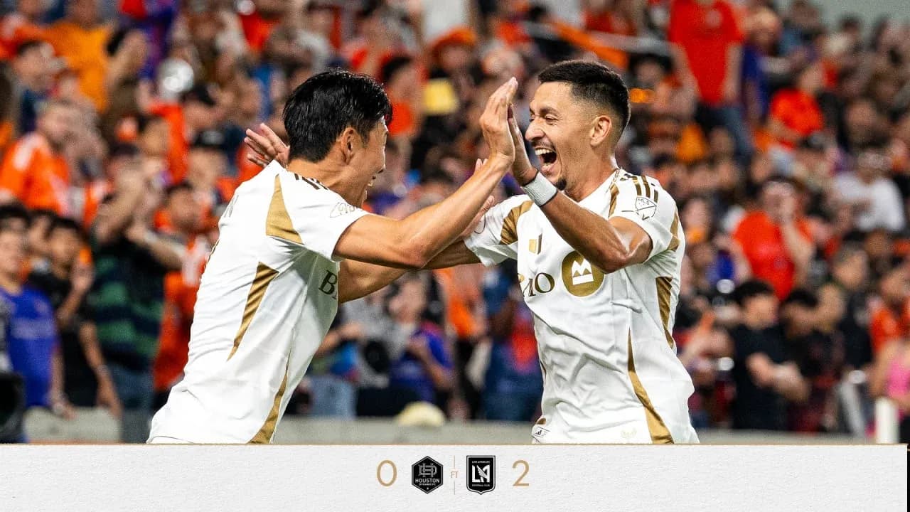 Players celebrating a goal during match Players celebrating a goal during match