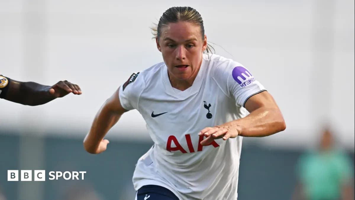 Player in Tottenham kit sprinting during match Player in Tottenham kit sprinting during match