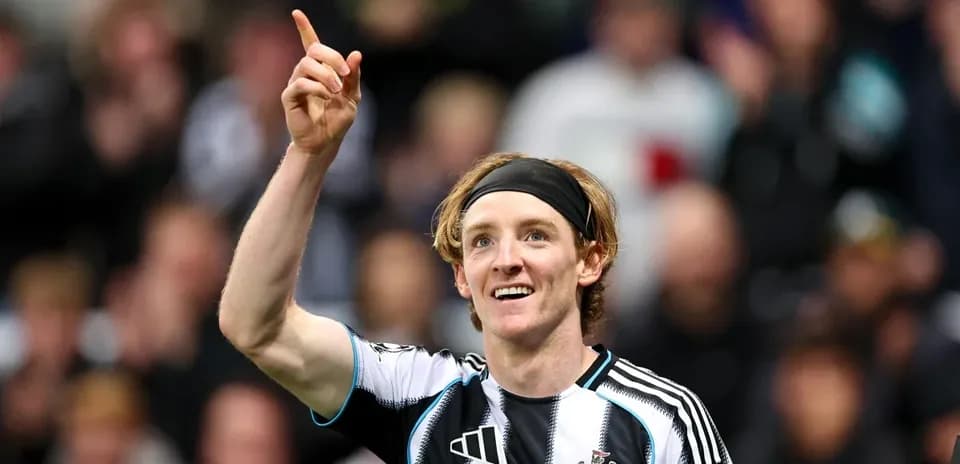 Player celebrating a goal with raised finger Player celebrating a goal with raised finger