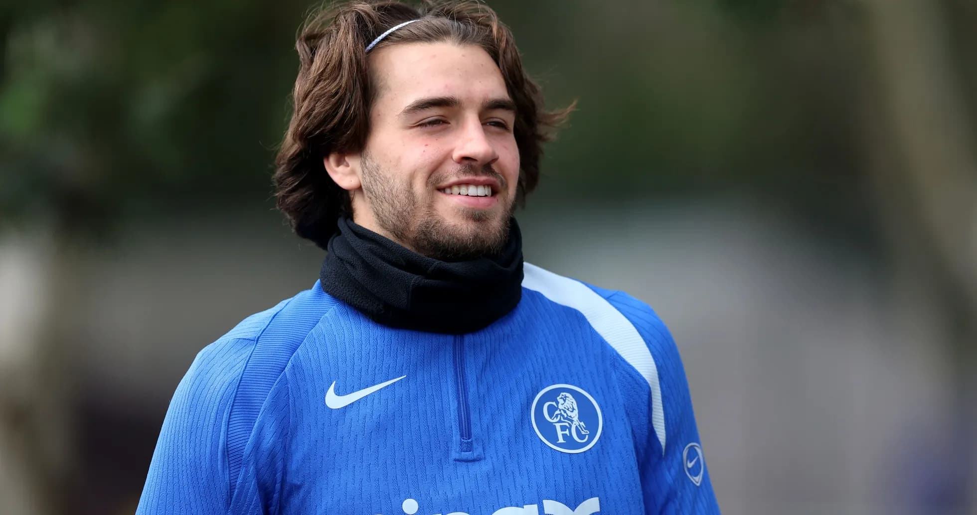 Player in blue training kit smiling during practice Player in blue training kit smiling during practice