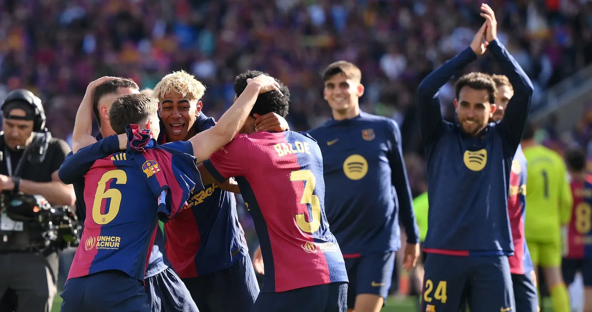 Barcelona players celebrating a victory on the pitch Barcelona players celebrating a victory on the pitch