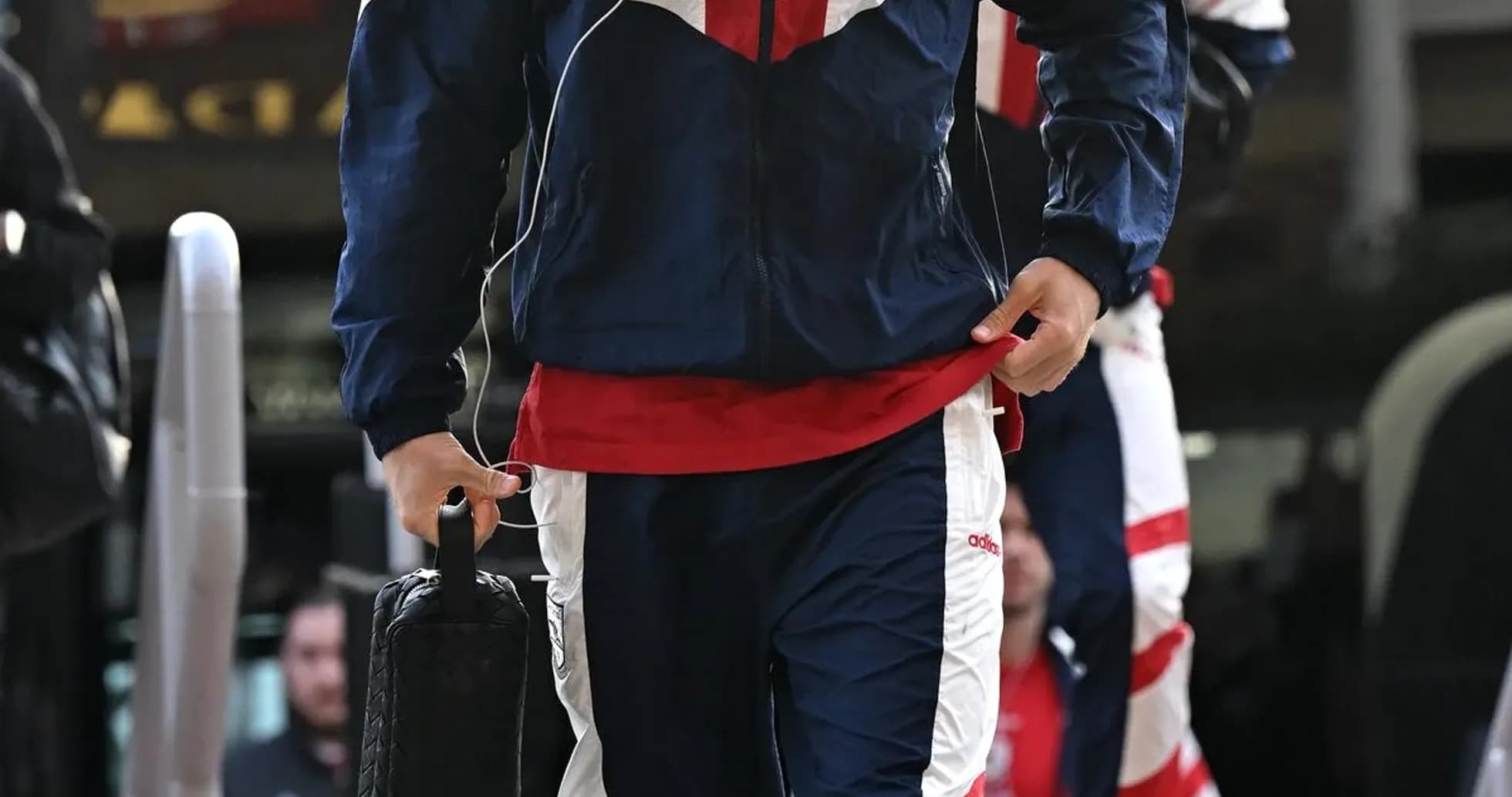 Player arriving in team tracksuit before match Player arriving in team tracksuit before match