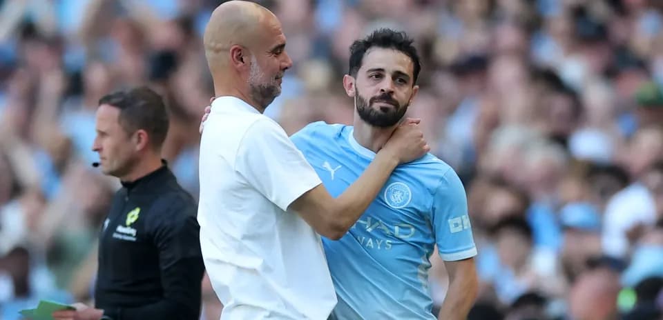 Coach and player interacting during match substitution Coach and player interacting during match substitution