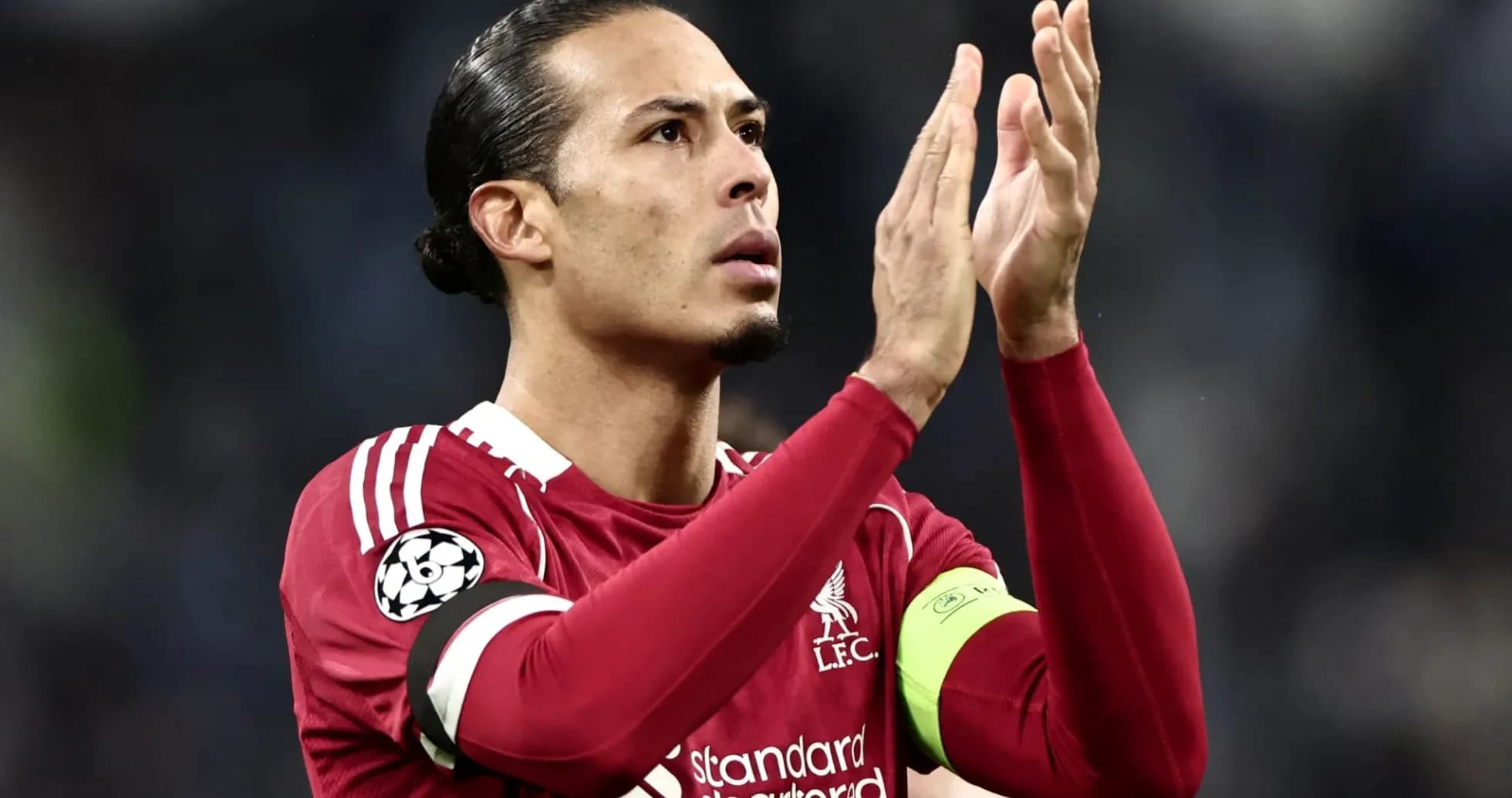 Player applauding fans in Liverpool FC kit Player applauding fans in Liverpool FC kit