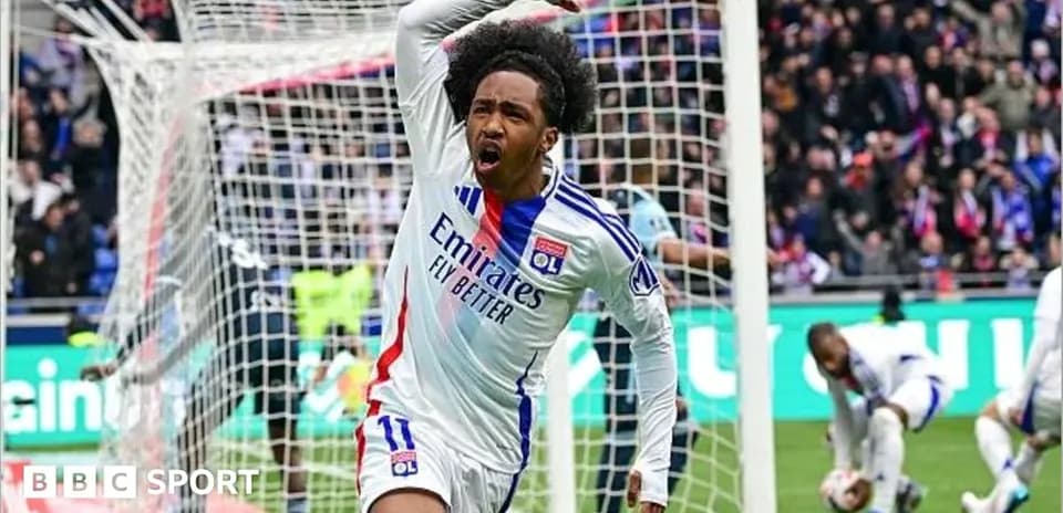 Player celebrating a goal in front of the goalpost Player celebrating a goal in front of the goalpost