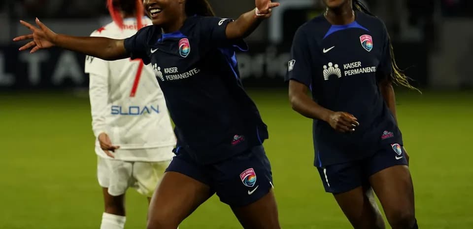 Players celebrating during NWSL match Players celebrating during NWSL match
