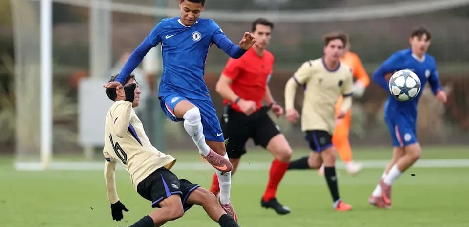 Player in blue jumping over opponent during match Player in blue jumping over opponent during match