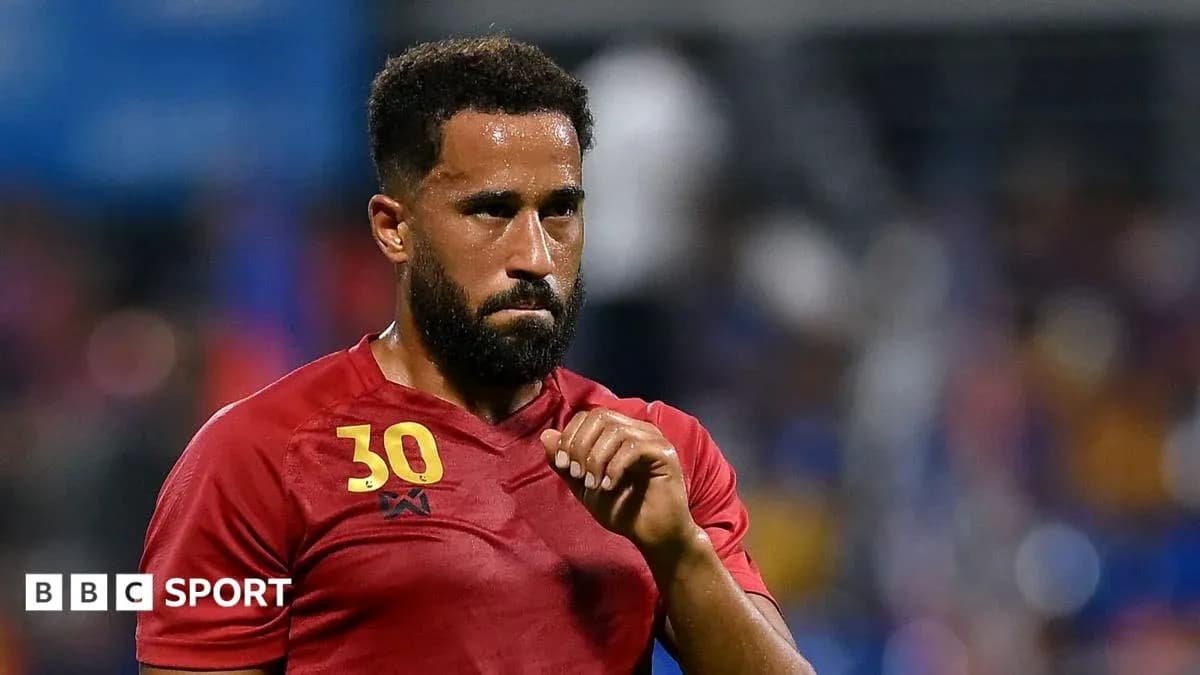 Player wearing red jersey during a match Player wearing red jersey during a match