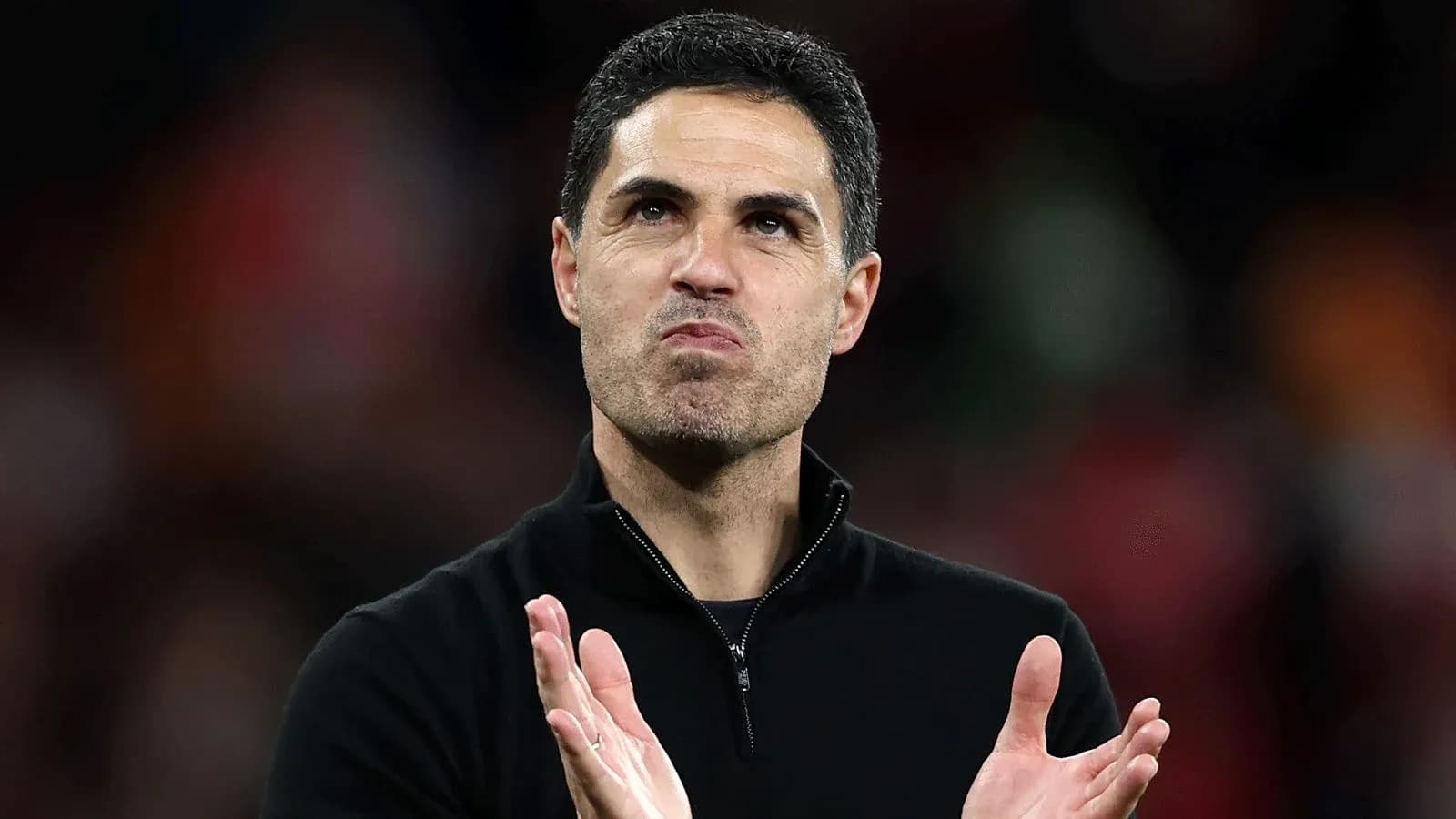 Manager applauding after a match Manager applauding after a match