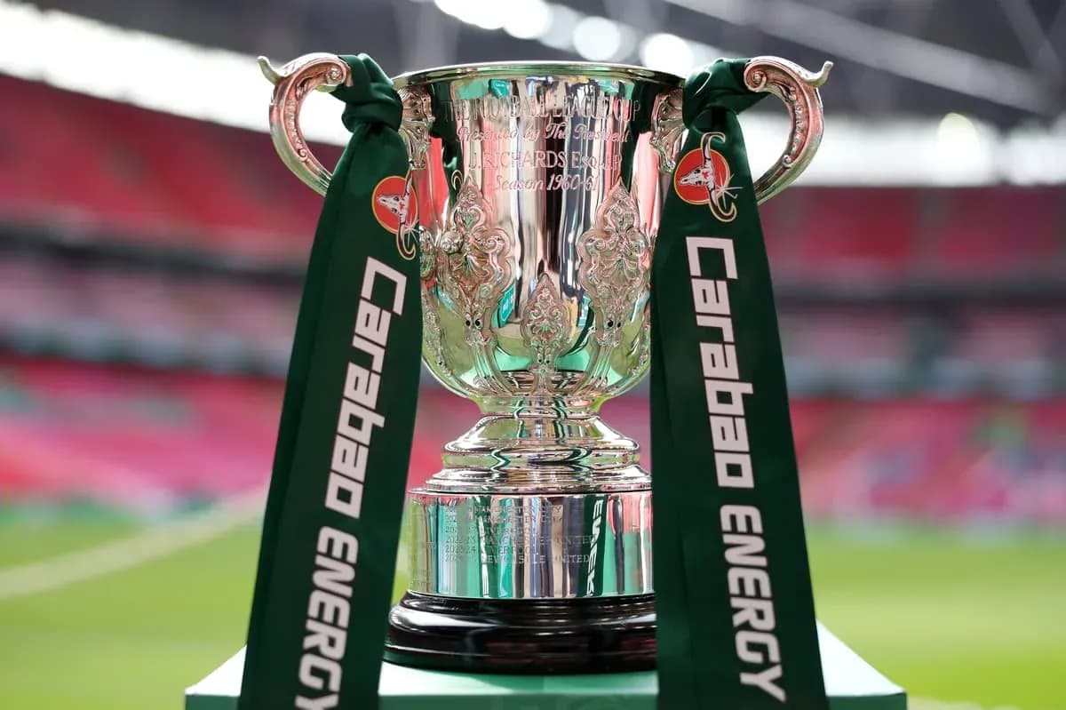 Carabao Cup trophy displayed on a green pedestal Carabao Cup trophy displayed on a green pedestal