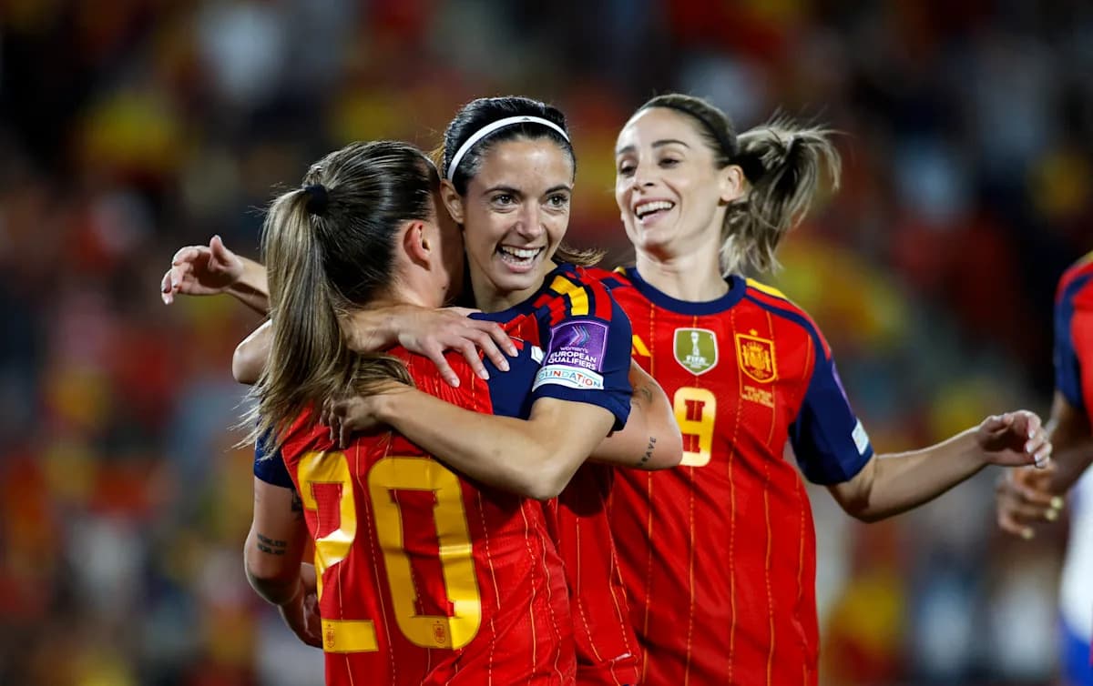 Spanish players celebrating a goal during a match Spanish players celebrating a goal during a match