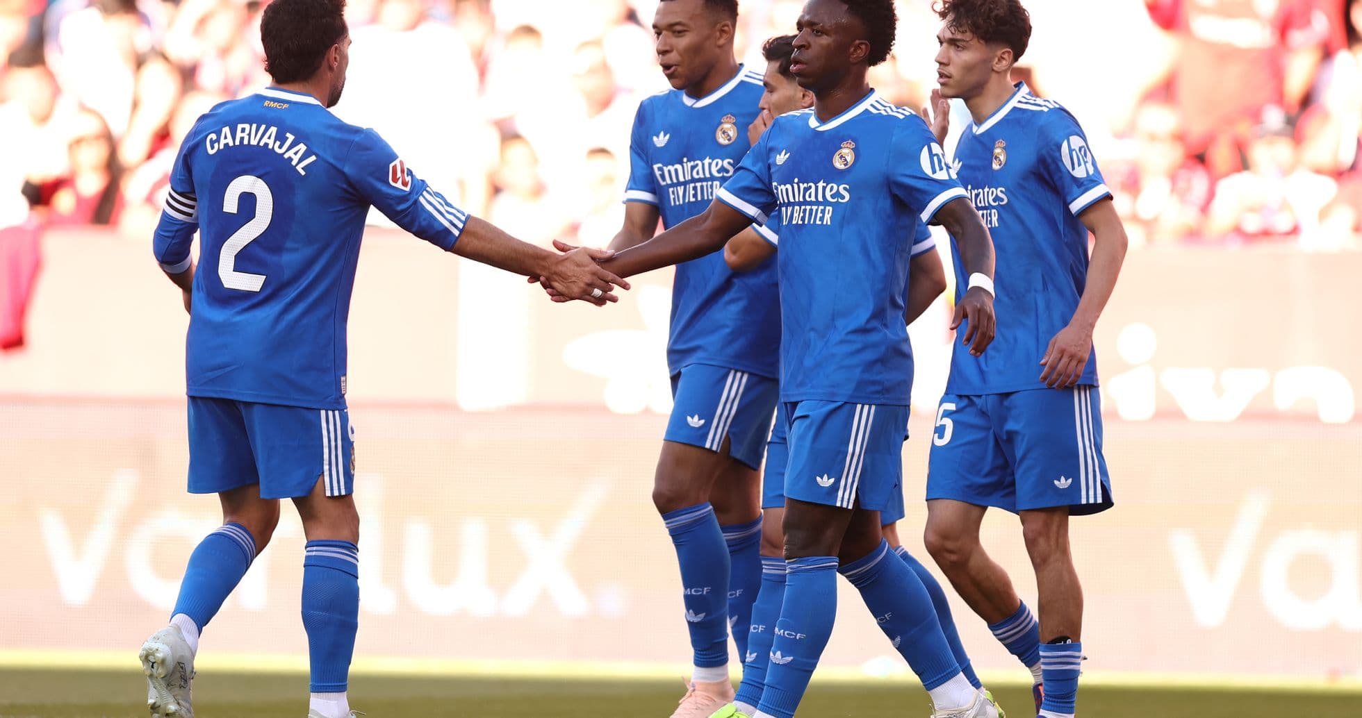 Real Madrid players celebrating a goal Real Madrid players celebrating a goal