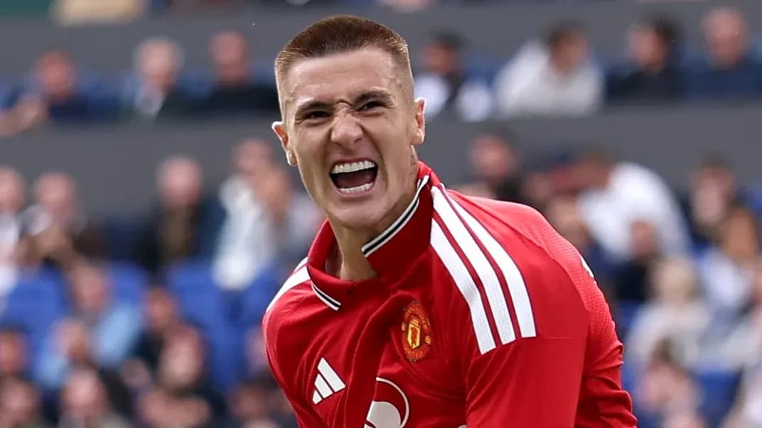 Player celebrating passionately in Manchester United jersey Player celebrating passionately in Manchester United jersey